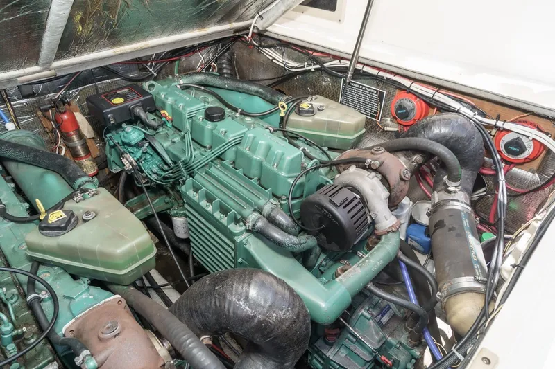 Slide: The Image of Engine compartment of a 1999 Albemarle 290 Express Fisherman boat, showcasing detailed machinery. - 61