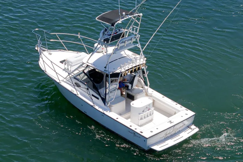 Slide: The Image of 1999 Albemarle 290 Express Fisherman boat cruising on open water. - 7