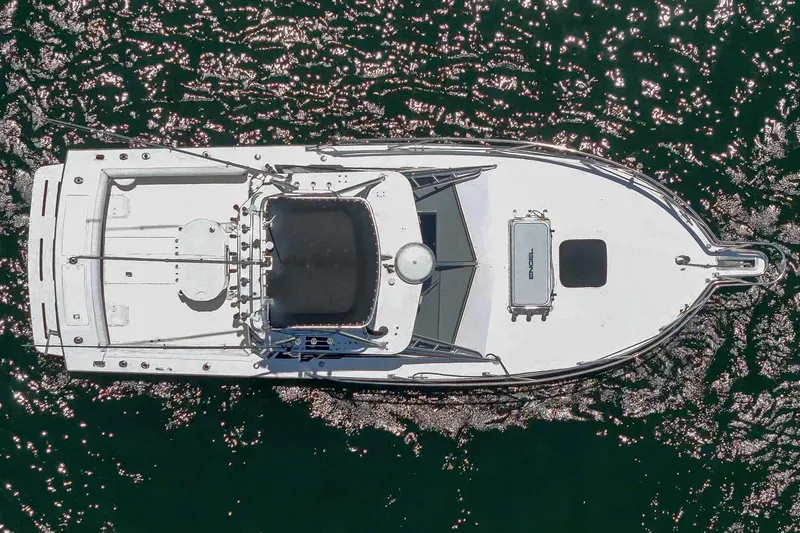 Slide: The Image of Overhead view of 1999 Albemarle 290 Express Fisherman boat on sparkling water. - 8