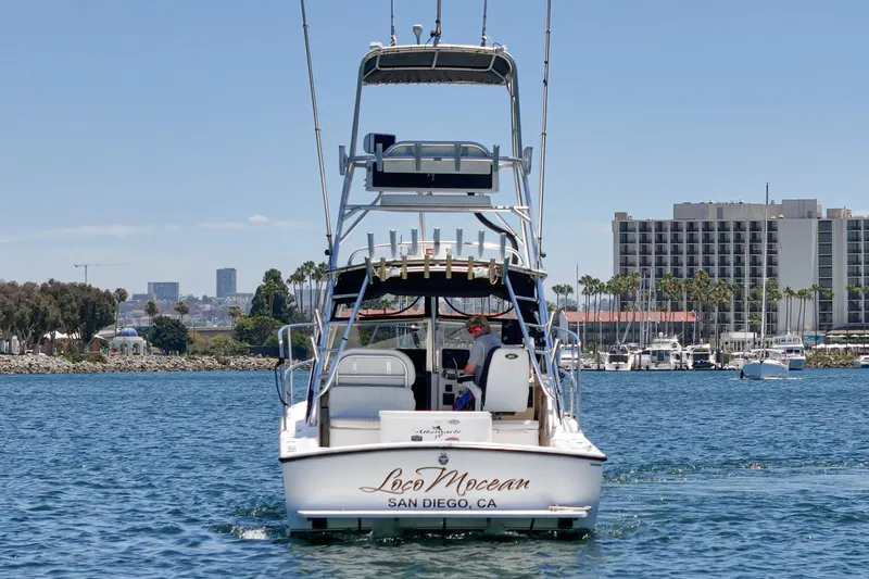 Slide: The Image of 1999 Albemarle 290 Express Fisherman boat on San Diego waters, cityscape in background. - 9