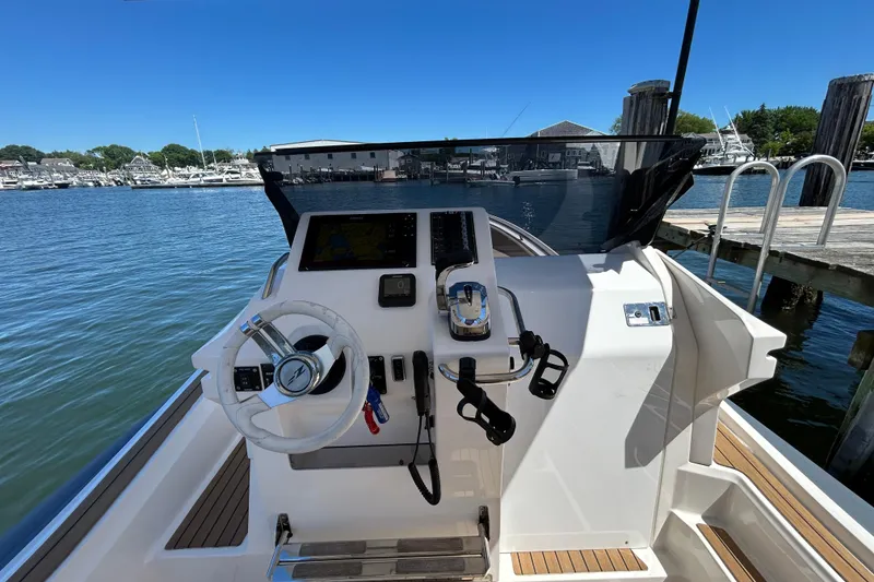 Slide: The Image of Cockpit view of 2020 Zar Formenti 85 SL boat docked at marina. - 11