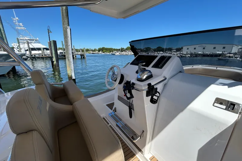 Slide: The Image of Cockpit view of 2020 Zar Formenti 85 SL boat docked at marina. - 12