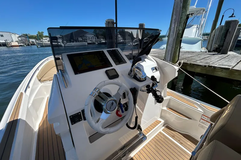 Slide: The Image of Cockpit of 2020 Zar Formenti 85 SL boat with steering wheel and navigation system. - 14