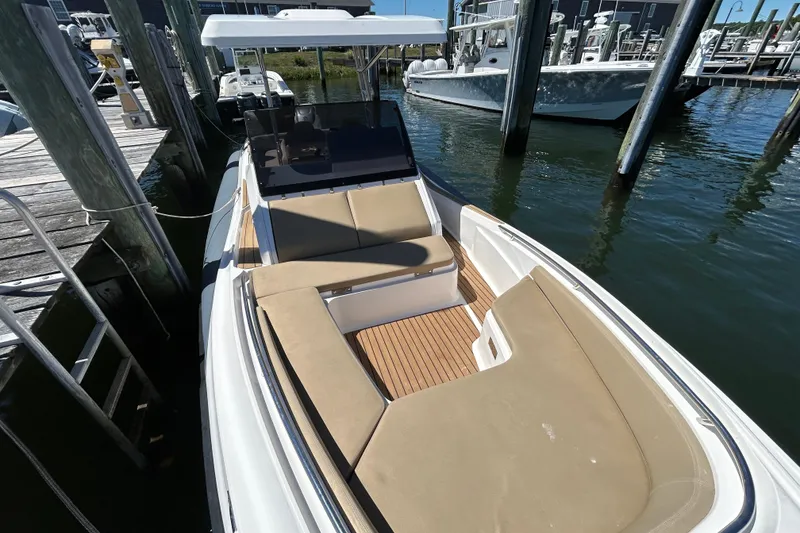 Slide: The Image of 2020 Zar Formenti 85 SL boat docked, featuring spacious seating and sleek design. - 15