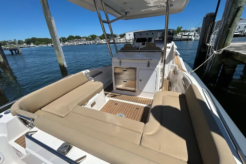 Slide: The Image of 2020 Zar Formenti 85 SL boat interior with beige seating and wooden deck. - 7
