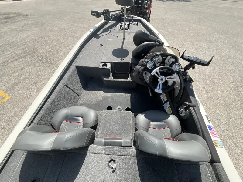 Slide: The Image of The image shows the cockpit of a 2023 Tracker boat with gray seats and a modern helm. - 9