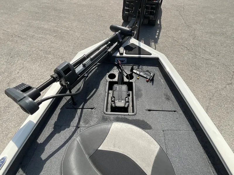 Slide: The Image of Bow deck of a Tracker boat with seat, controls, and storage. - 6