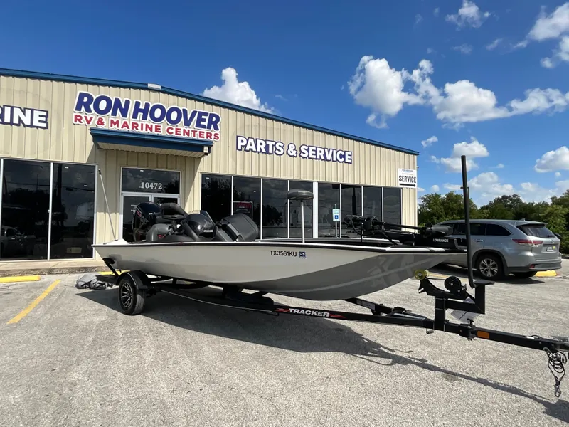 Slide: The Image of A 2023 Tracker boat on a trailer in front of a marine center building. - 3