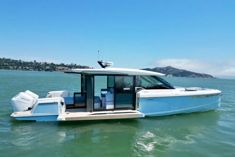 Slide: The Image of 2027 Saxdor 400 GTC boat cruising on a sunny day, showcasing sleek design and modern features. - 1