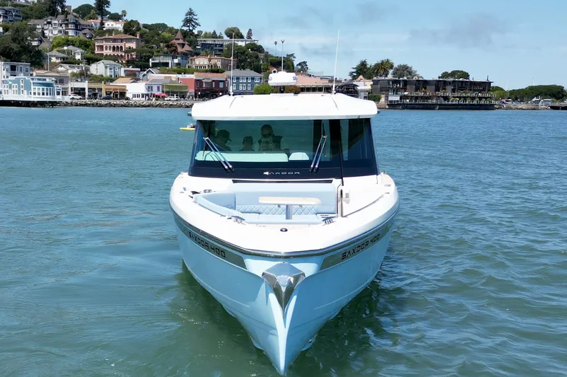 Slide: The Image of Saxdor 400 GTC 2027 boat cruising near scenic waterfront homes. - 14
