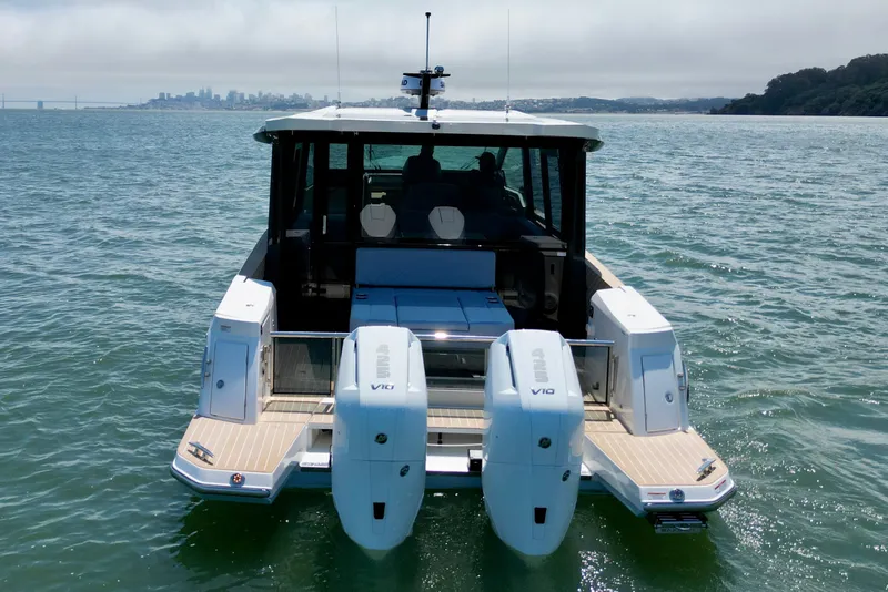 Slide: The Image of 2027 Saxdor 400 GTC boat with dual engines on open water. - 7