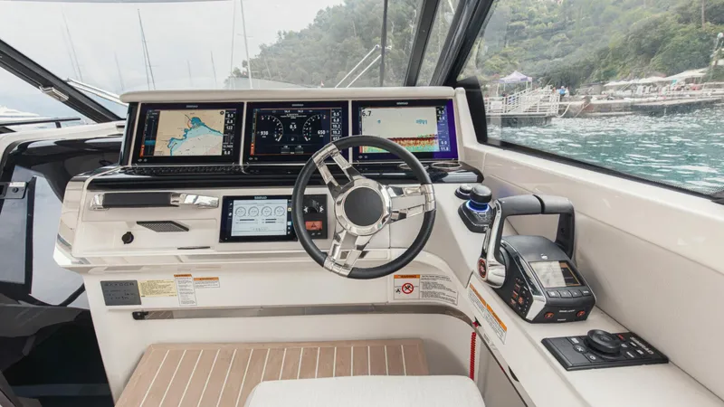 Slide: The Image of Saxdor 400 GTC 2025 boat cockpit with advanced navigation systems and controls. - 18