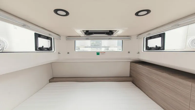 Slide: The Image of Interior cabin of 2025 Saxdor 400 GTC boat with modern design and ample natural light. - 17