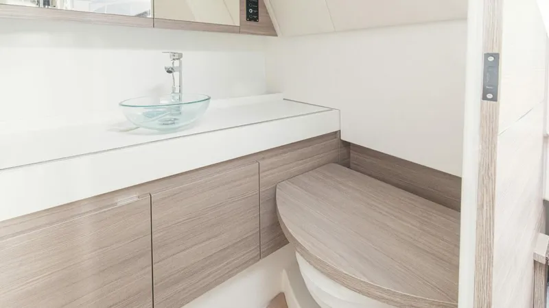 Slide: The Image of Modern bathroom interior of 2025 Saxdor 400 GTC boat with sleek wooden cabinetry. - 19