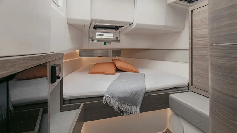 Slide: The Image of Interior cabin of 2025 Saxdor 400 GTC with bed, pillows, and blanket. - 16