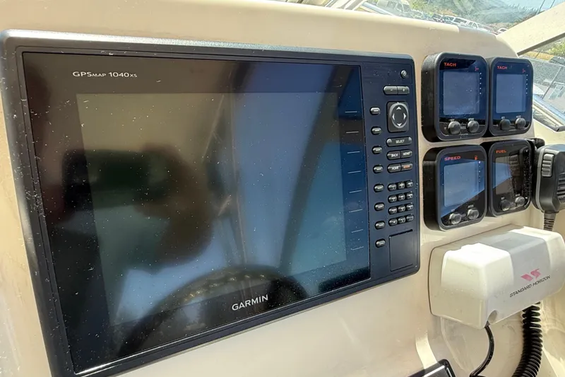 Slide: The Image of Dashboard of a 2007 Pursuit 2570 Offshore boat with Garmin GPS and gauges. - 45