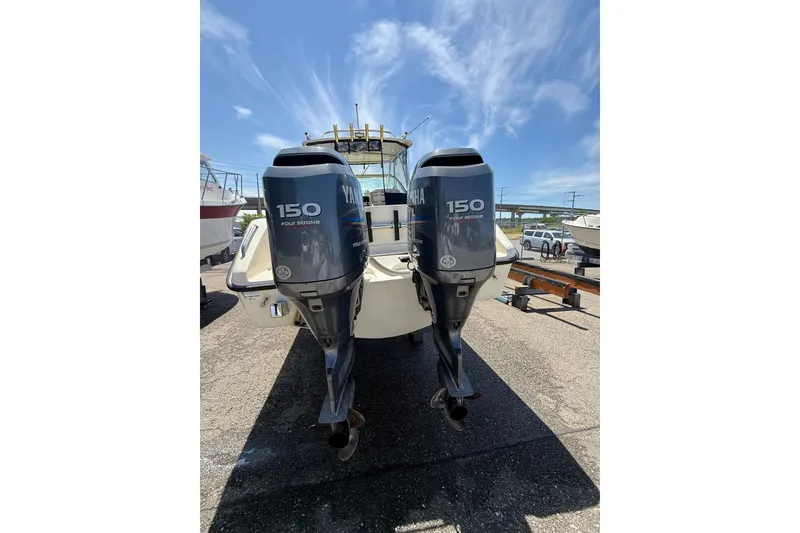 Slide: The Image of 2007 Pursuit 2570 Offshore boat with twin Yamaha 150 four-stroke engines. - 57
