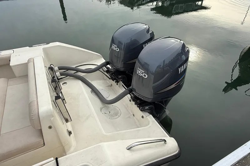 Slide: The Image of 2006 Pursuit 2570 Offshore boat with twin Yamaha 150 outboard engines on calm water. - 31