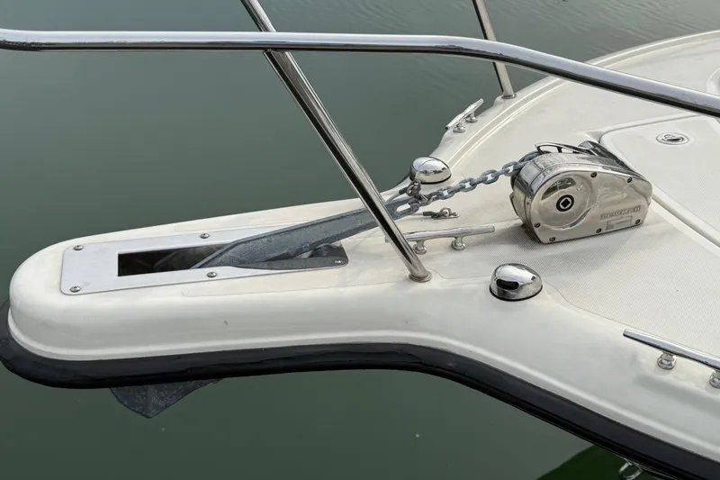 Slide: The Image of Bow of a 2006 Pursuit 2570 Offshore boat with anchor and winch system. - 32