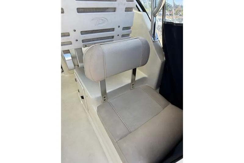 Slide: The Image of 2007 Pursuit 2570 Offshore boat seat with cushioned backrest and sleek design. - 11