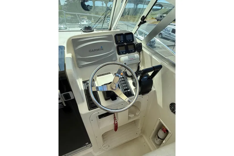 Slide: The Image of Helm of 2007 Pursuit 2570 Offshore boat with Garmin navigation system. - 39