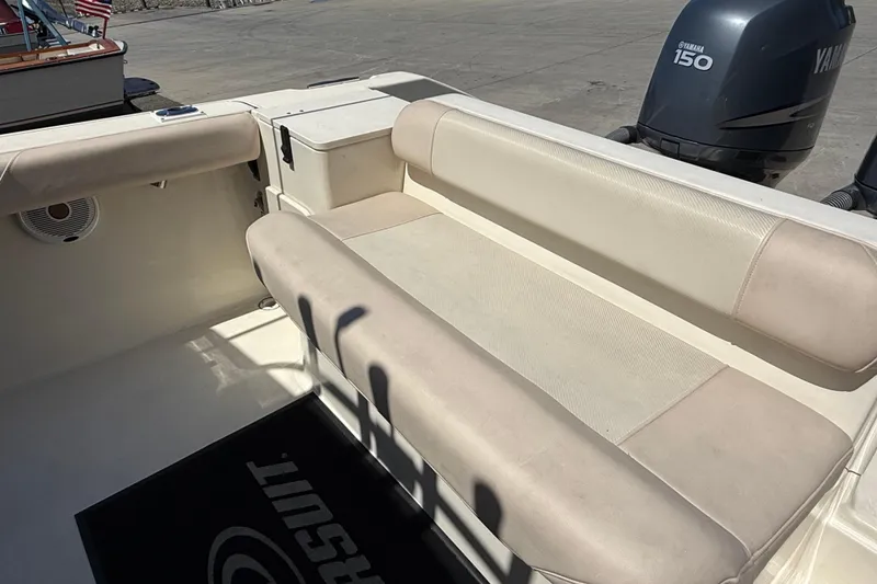 Slide: The Image of 2007 Pursuit 2570 Offshore boat interior with seating and Yamaha 150 engine. - 22