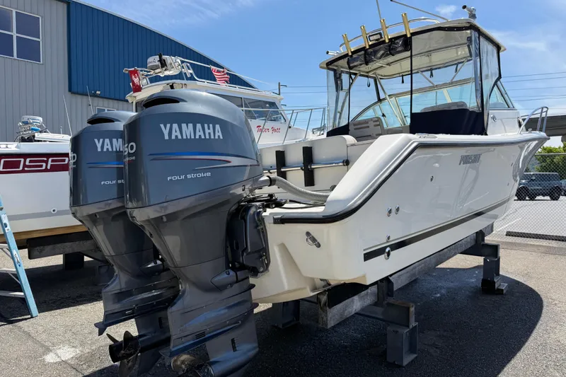 Slide: The Image of 2007 Pursuit 2570 Offshore boat with twin Yamaha outboard engines on display. - 49