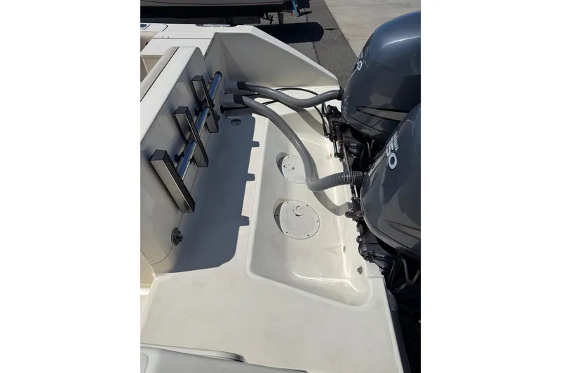 Slide: The Image of 2007 Pursuit 2570 Offshore boat deck with dual outboard motors. - 26