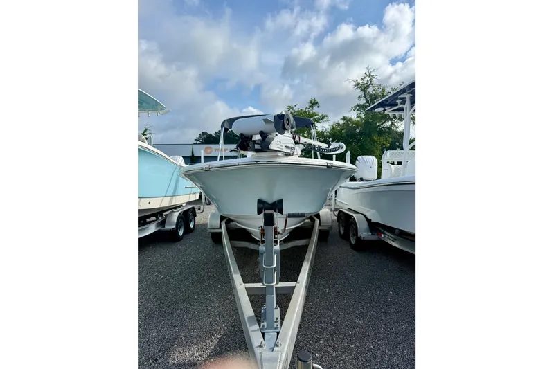 Slide: The Image of 2015 Sportsman Masters 227 Bay Boat on trailer under cloudy sky. - 3