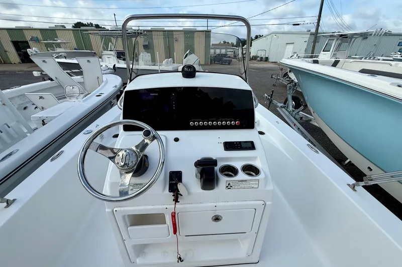 Slide: The Image of 2015 Sportsman Masters 227 Bay Boat dashboard with steering wheel and controls. - 8