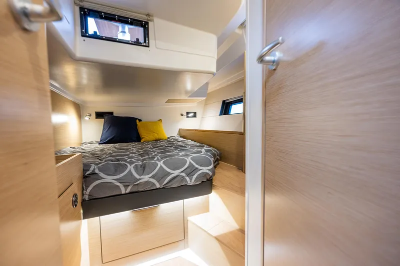 Slide: The Image of Cozy cabin interior of 2025 Hanse 460 yacht with modern bedding and wooden finishes. - 28