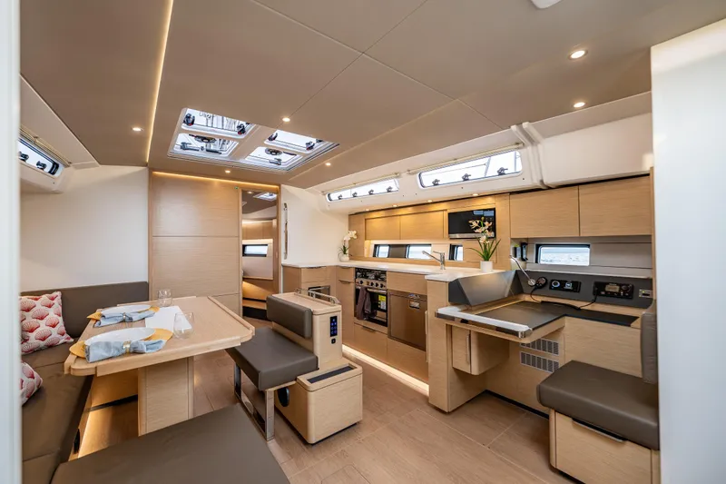 Slide: The Image of Luxurious interior of 2025 Hanse 460 yacht with modern kitchen and dining area. - 17