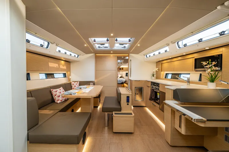 Slide: The Image of Luxurious interior of 2025 Hanse 460 yacht with modern kitchen and seating area. - 10
