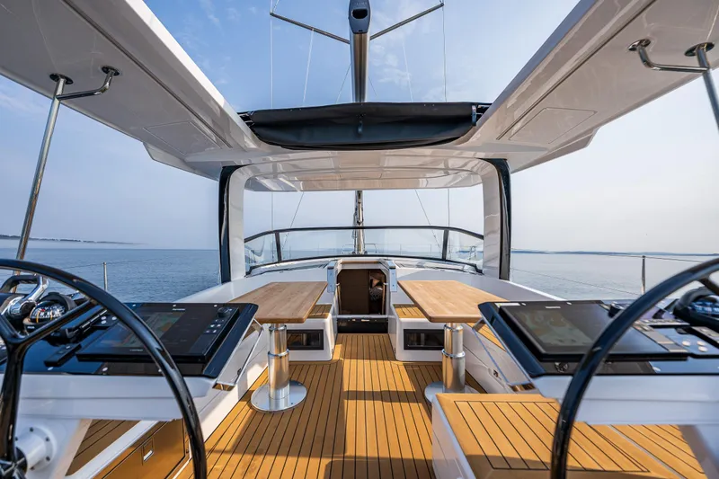 Slide: The Image of Luxurious 2025 Hanse 460 yacht interior with modern helm and spacious deck. - 9