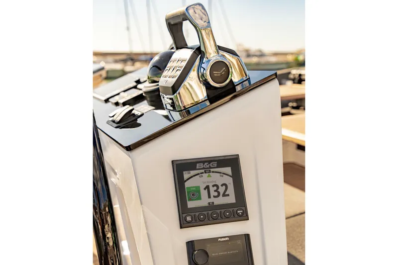 Slide: The Image of Control panel of 2025 Hanse 460 yacht with navigation display and throttle. - 33
