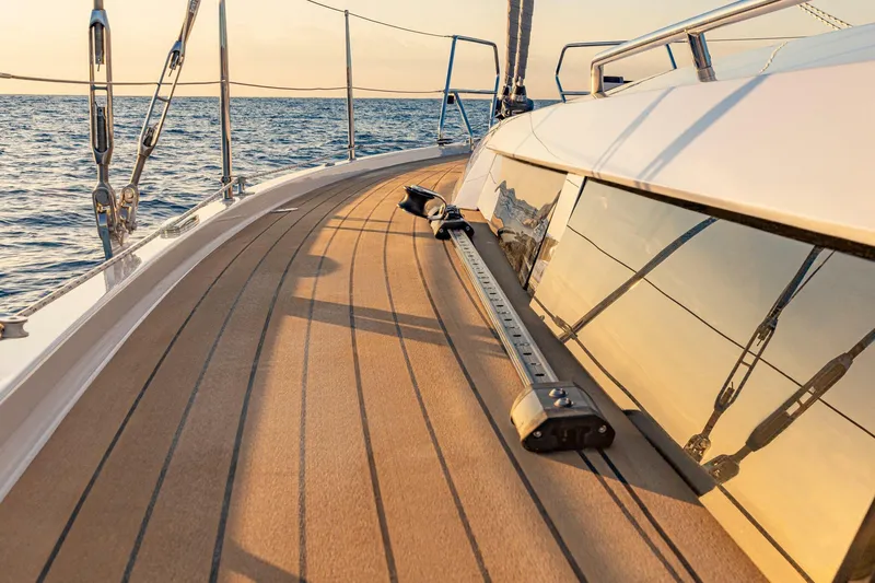 Slide: The Image of Sleek deck of 2025 Hanse 460 yacht with ocean view at sunset. - 35