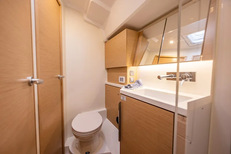 Slide: The Image of Modern bathroom interior of 2025 Hanse 460 yacht with sleek wood finishes. - 24