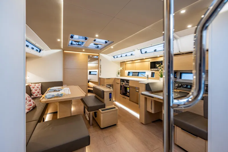 Slide: The Image of Luxurious interior of 2025 Hanse 460 yacht with modern kitchen and dining area. - 12