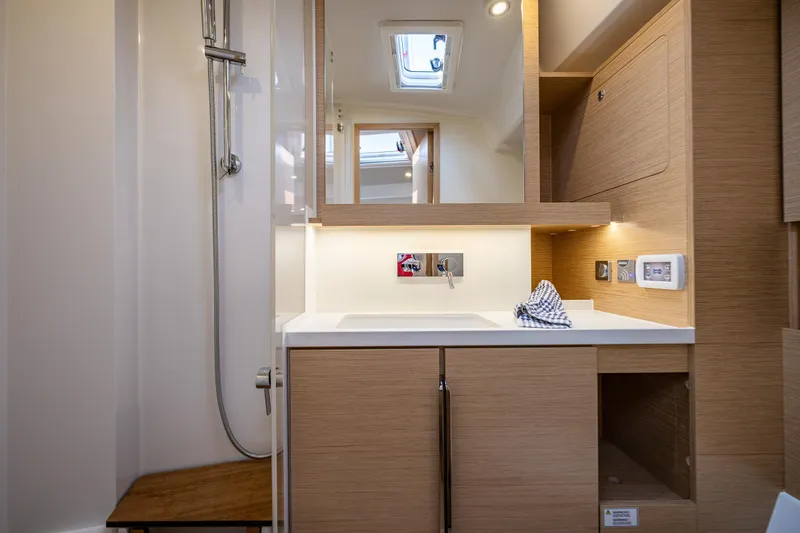 Slide: The Image of Modern bathroom interior of 2025 Hanse 460 yacht with wooden cabinetry and sleek fixtures. - 19