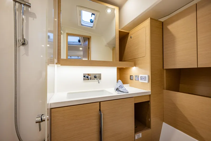 Slide: The Image of Modern bathroom interior of 2025 Hanse 460 yacht with wooden cabinetry and sleek fixtures. - 30