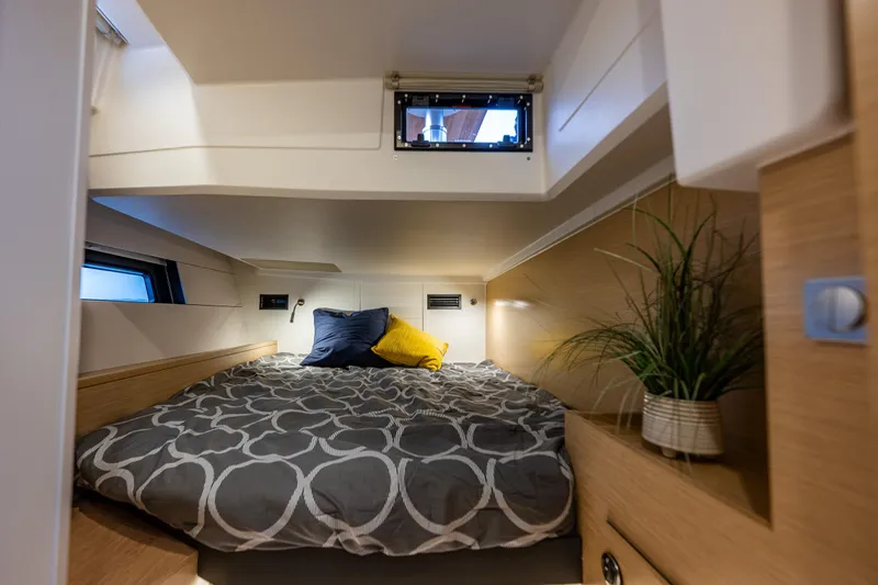 Slide: The Image of Cozy cabin interior of 2025 Hanse 460 yacht with modern bedding and decor. - 26