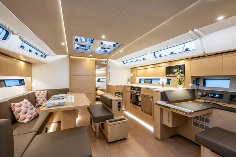 Slide: The Image of Luxurious interior of 2025 Hanse 460 yacht with modern kitchen and dining area. - 11