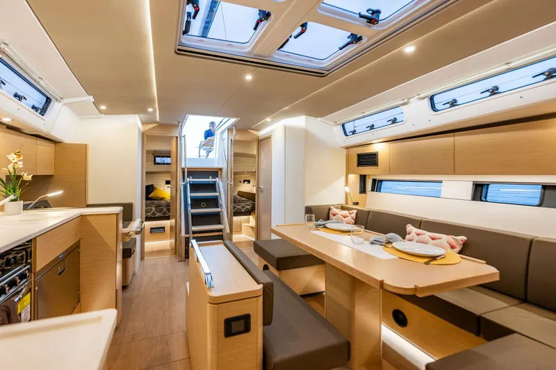 Slide: The Image of Luxurious interior of 2025 Hanse 460 yacht with modern dining and living area. - 31