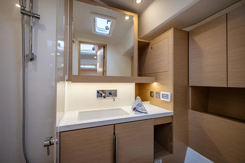 Slide: The Image of Modern bathroom interior of 2025 Hanse 460 yacht with wooden cabinetry and sleek fixtures. - 20