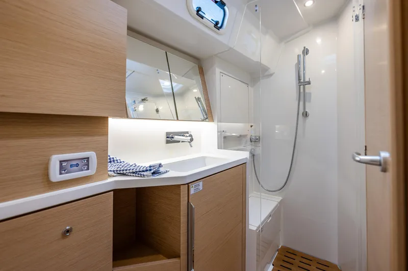 Slide: The Image of Modern bathroom in 2025 Hanse 460 yacht with sleek fixtures and wooden accents. - 23