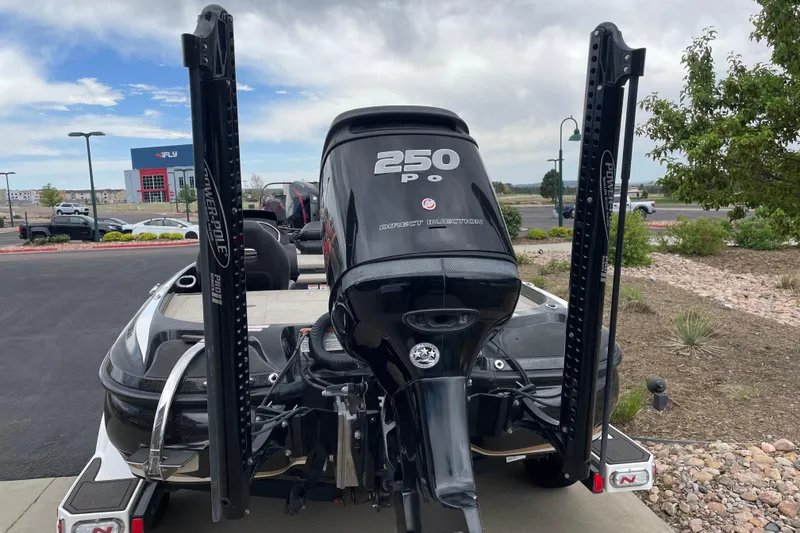 Slide: The Image of 2016 Nitro Z21 boat with 250 Pro motor, parked outdoors. - 4