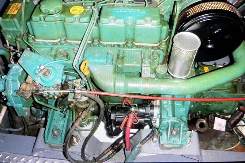 Slide: The Image of Engine of a 1987 Senator-Chien Hwa Futura Sundeck boat, showcasing mechanical components. - 11