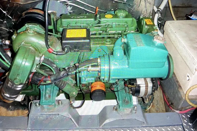 Slide: The Image of Engine of a 1987 Senator-Chien Hwa Futura Sundeck boat, showcasing mechanical components. - 12