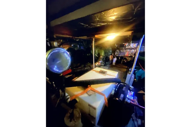 Slide: The Image of Engine room of a 1987 Senator-Chien Hwa Futura Sundeck, featuring mechanical components and lighting. - 13