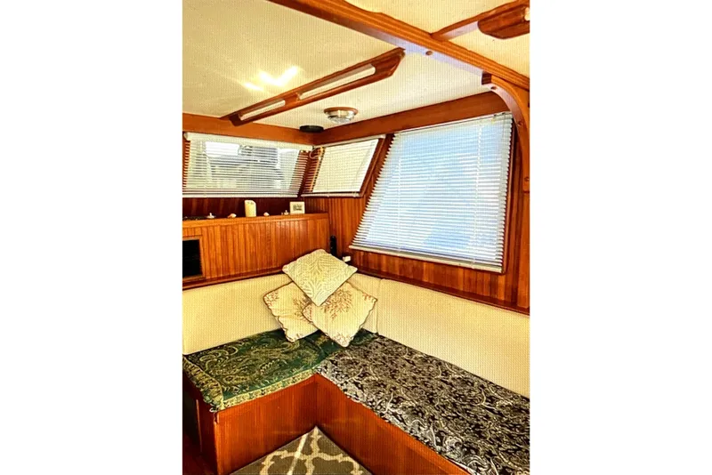 Slide: The Image of Interior of 1987 Senator-Chien Hwa Futura Sundeck with wooden paneling and cushioned seating. - 15